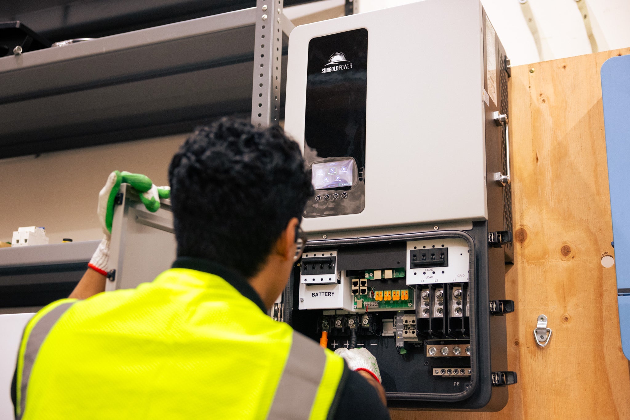A SunGoldPower inverter being installed